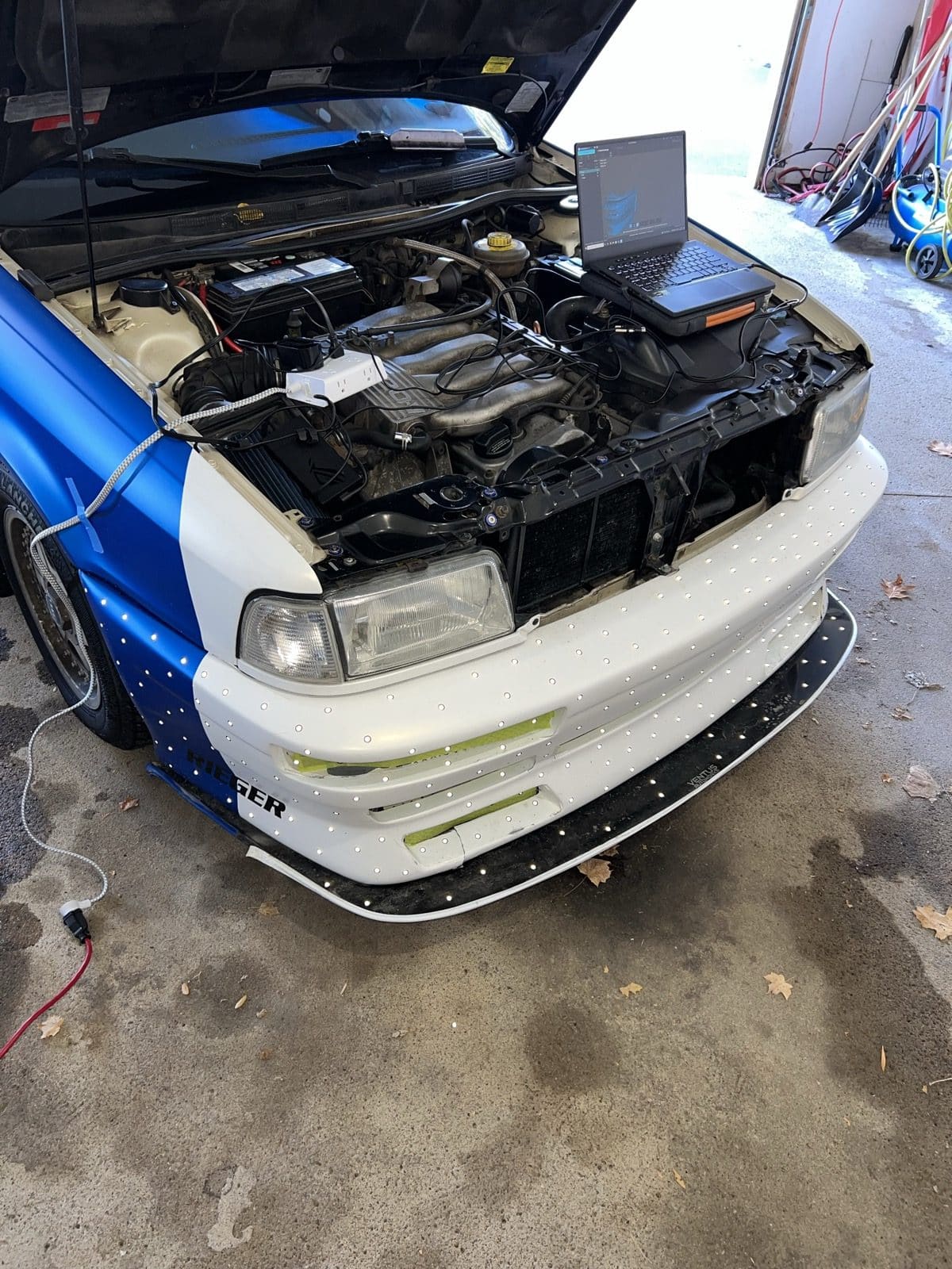 Audi 90 front bumper covered in reference targets during a structured-light 3D scan
